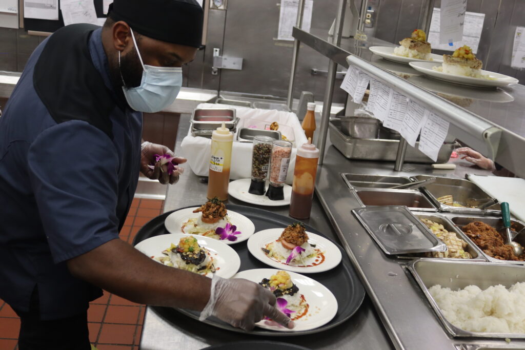 sous chef plates food for a special event