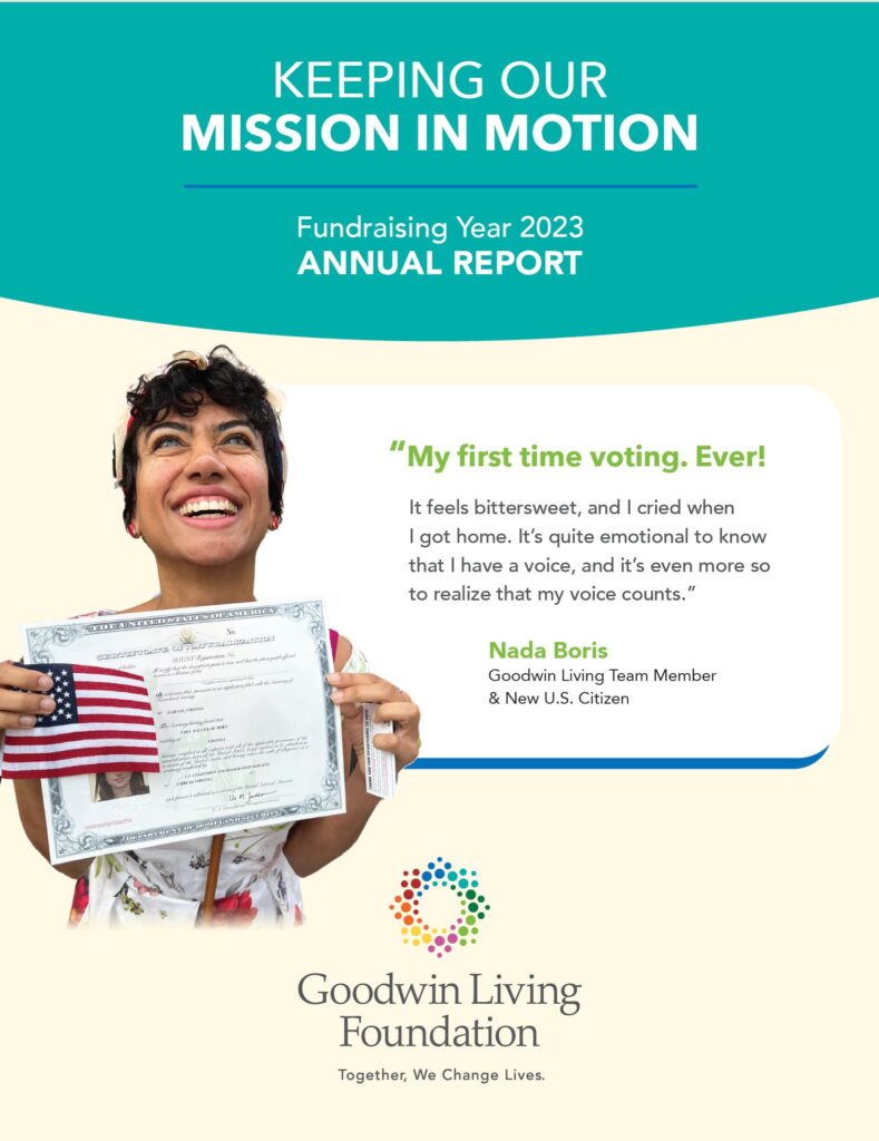 a young woman holds an American flag and her certificate of U.S. citizenship as she smiles at the camera. Keeping our Mission in Motion Goodwin Living Foundation Annual Report 2023.