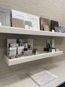 a selection of sample tiles arranged on floating shelves