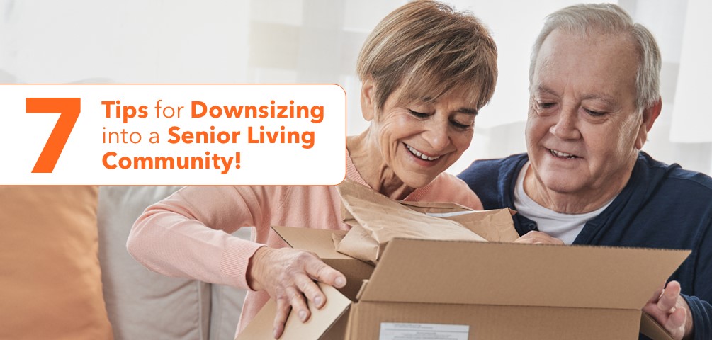 7 Tips for Downsizing into a Senior Living Community. An older couple pack a cardboard box together.