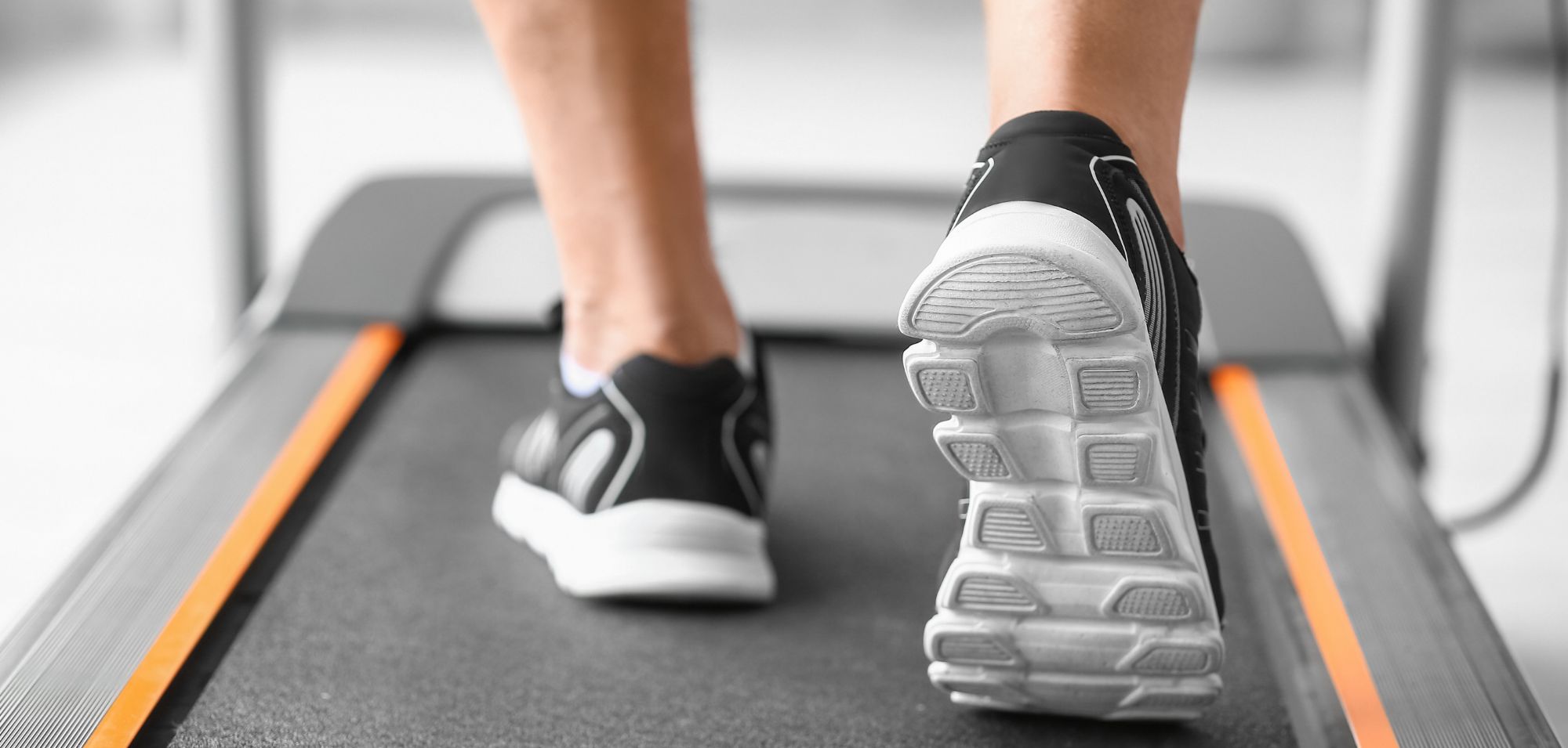 GaitBetter. An older adult's feet walking on a treadmill.