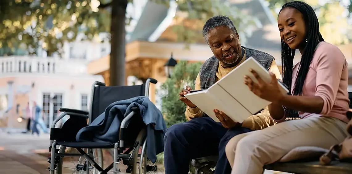 Woman and a man reading on a bench