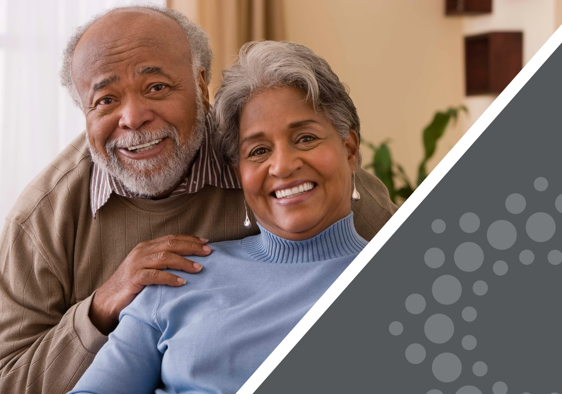 senior couple smiling at the camera