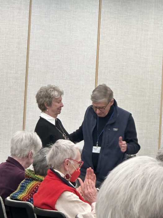 Candace supports Norman at the reading of his play, "God's Waiting Room."